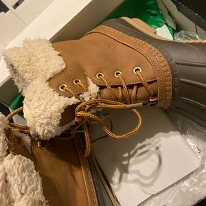Tan and brown “duck boots”. Slightly worn.